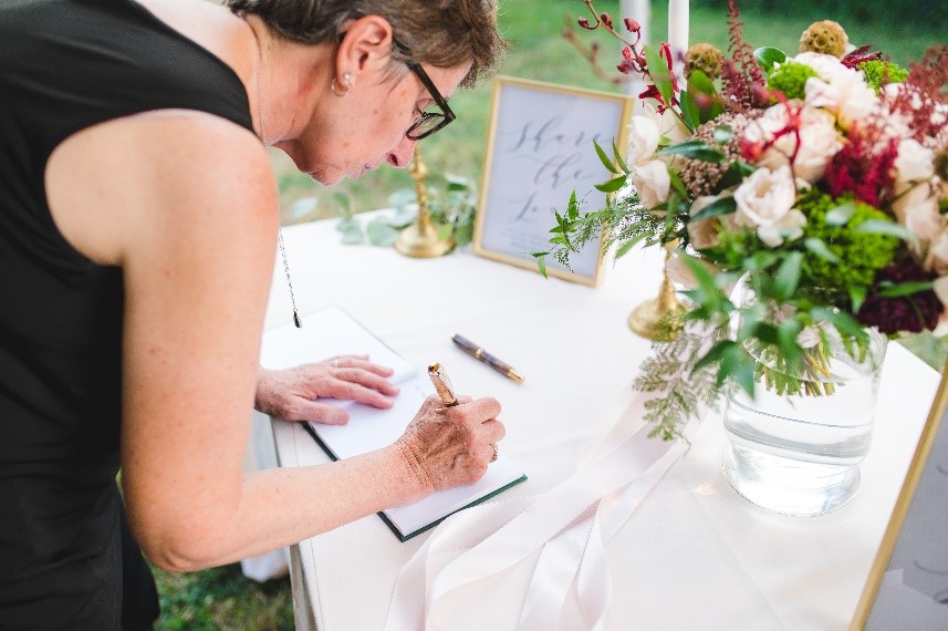 Example of repurposing a bridal bouquet on a guest book table